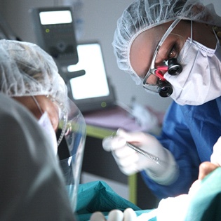 Dentists performing dental work on a patient