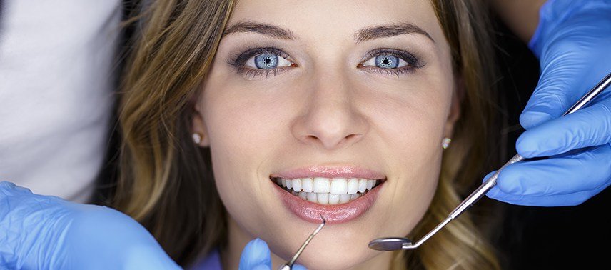 Woman receiving dental exam