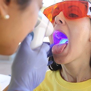 Patient receiving oral cancer screening