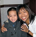 Dr. LaCap smiling with young patient