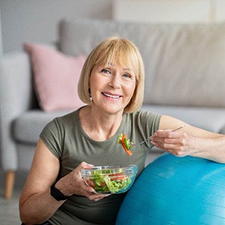 woman eating in living room