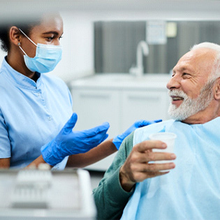 a dentist discussing dentures in Tappan