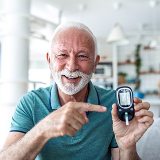 A man testing his blood sugar