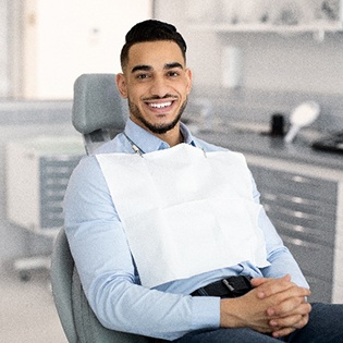 Man smiling while relaxing in treatment chair