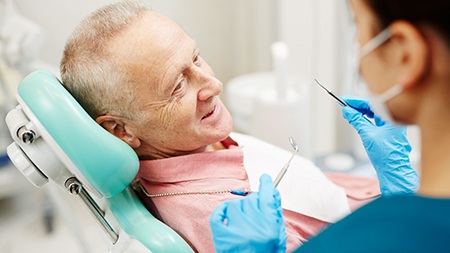 Older man undergoing a dental checkup