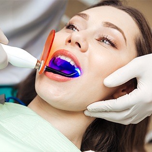 Woman receiving dental bonding