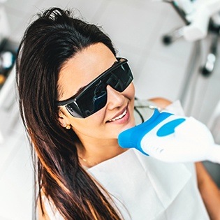 Woman receiving teeth whitening