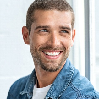 A young man smiling