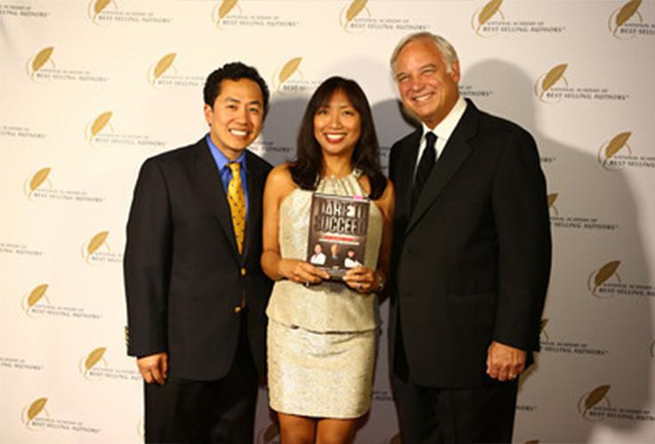 Dentists smiling with author