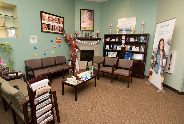 Dental treatment room with blue exam chair