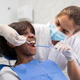 Woman receiving dental cleaning