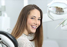 Woman in dental chair smiling