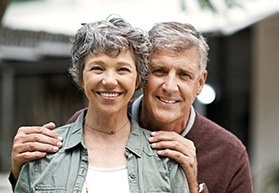 Smiling older man and woman