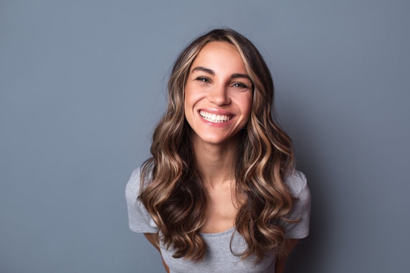 a young woman showing off her healthy teeth in Tappan