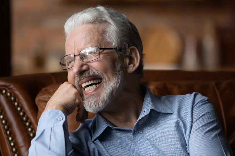 a mature man smiling with dentures in Tappan