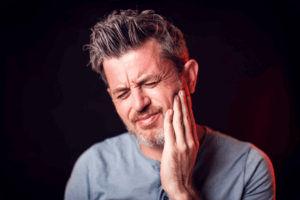 a patient dealing with jaw pain